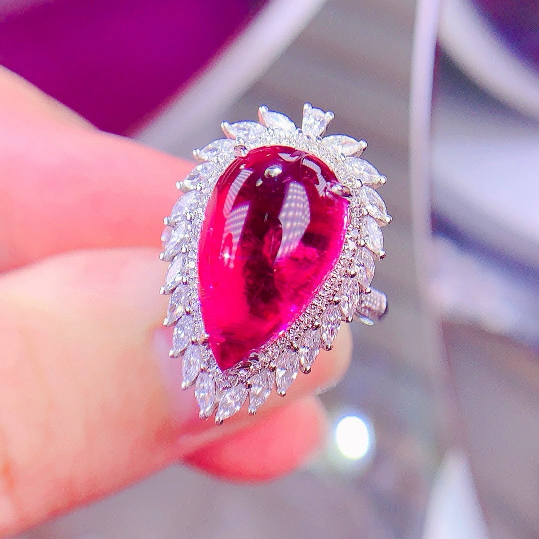 14k Gold 9.5 Ct Natural Tourmaline & Diamond Ring: Ref:231052424 // gold content:14k gold // ring size:7. 25us // // main gemstone:tourmaline // shape:pear // carat weight:9. 5ct // color:red // treatment:natural // // adjacent gemstone 2 : diamond