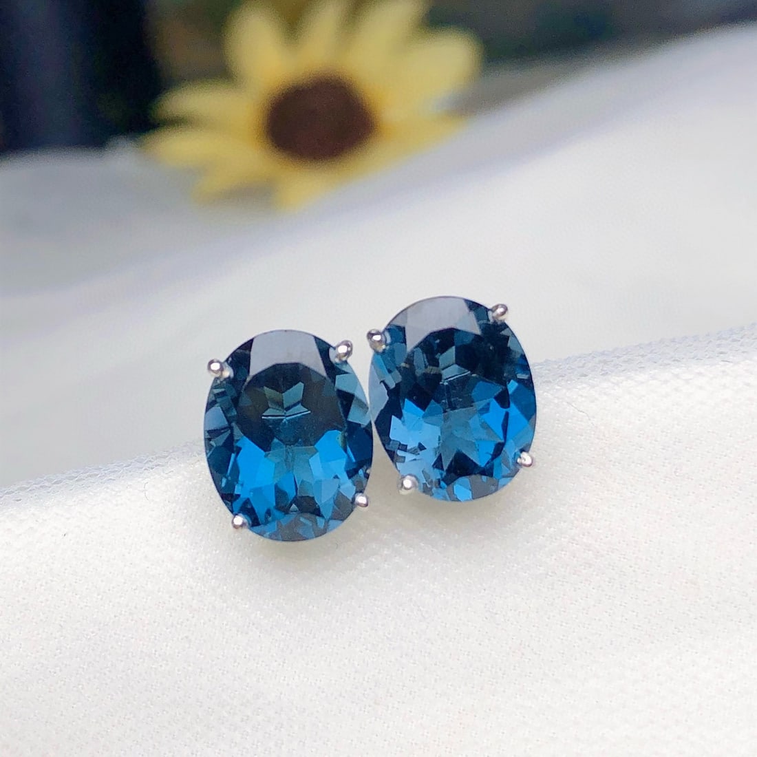 14k Gold 6.20 Ct Natural Topaz Earrings: Ref:231052448 // gold content:14k gold // main gemstone:topaz // shape:oval // carat weight:6. 20ct // color:blue // treatment:natural // Condition: New Low Estimate: 1300.00 High Estimate: 2000.00