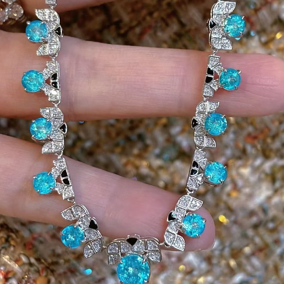 14k Gold 4.3 Ct Natural Paraiba Tourmaline & Diamond Necklace: Ref:231053014 // gold content:14k gold // main gemstone:paraiba tourmaline // shape:round // carat weight:4. 3ct // color:neon blue // treatment:natural // cut grade:g // // adjacent gemstone 2 :