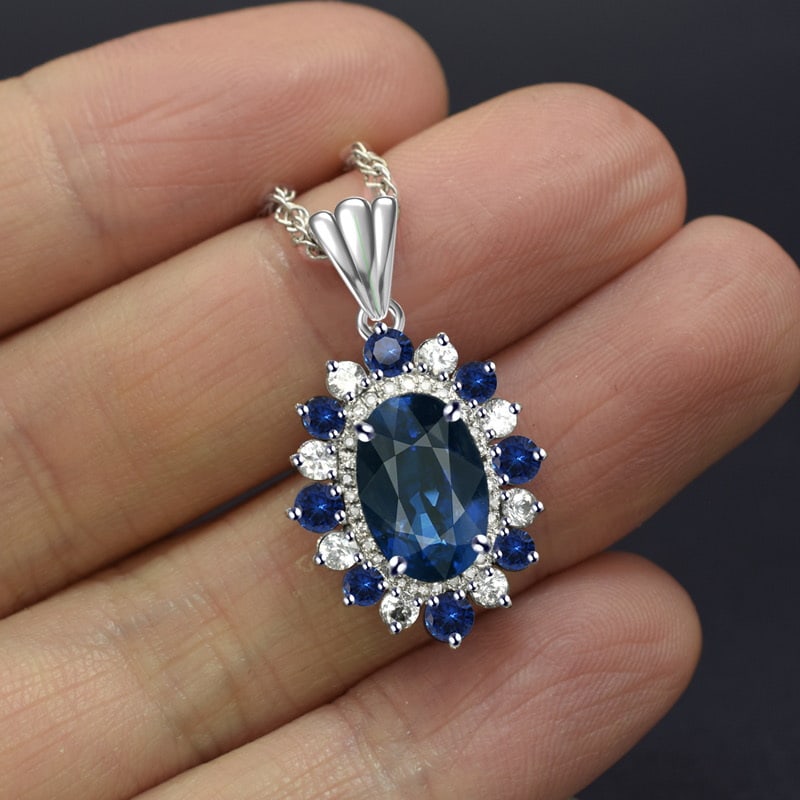 14k Gold 4.32 Ctw Natural Sapphire & Diamond & Sapphire Pendant( Without Chain ): Ref:231053027 // gold content:14k gold // main gemstone:sapphire // shape:oval // carat weight:3. 91ct // color:blue // treatment:natural // // adjacent gemstone 2 : diamond // number of stones:27 //