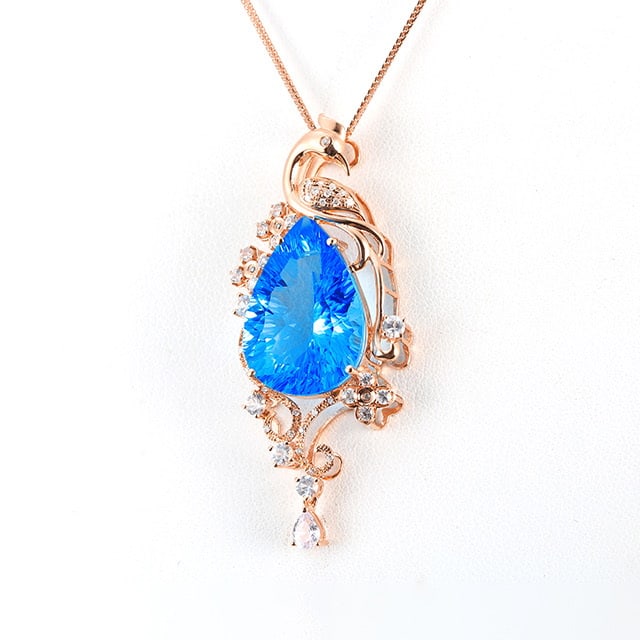 14k Gold 14.88 Ctw Natural Topaz & Diamond Pendant( Without Chain ): Ref:231053043 // gold content:14k gold // main gemstone:topaz // shape:pear // carat weight:14. 8ct // color:blue // treatment:natural // // adjacent gemstone 2 : diamond // number of stones:26 // sha
