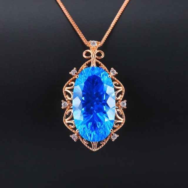 14k Gold 16.01 Ctw Natural Topaz & Sapphire Pendant( Without Chain ): Ref:231053082 // gold content:14k gold // main gemstone:topaz // shape:oval // carat weight:15. 79ct // color:blue // treatment:natural // // adjacent gemstone 2 : sapphire // number of stones:7 //