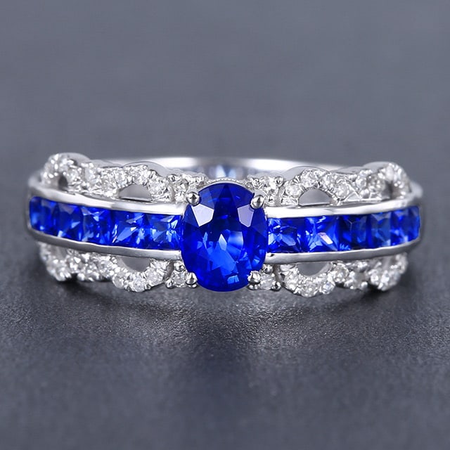 14k Gold 0.71 Ctw Natural Sapphire & Diamond Ring: Ref:231053125 // gold content:14k gold // ring size:7. 25us // // main gemstone:sapphire // shape:oval // carat weight:0. 58ct // color:blue // treatment:natural // // adjacent gemstone 2 : diamond