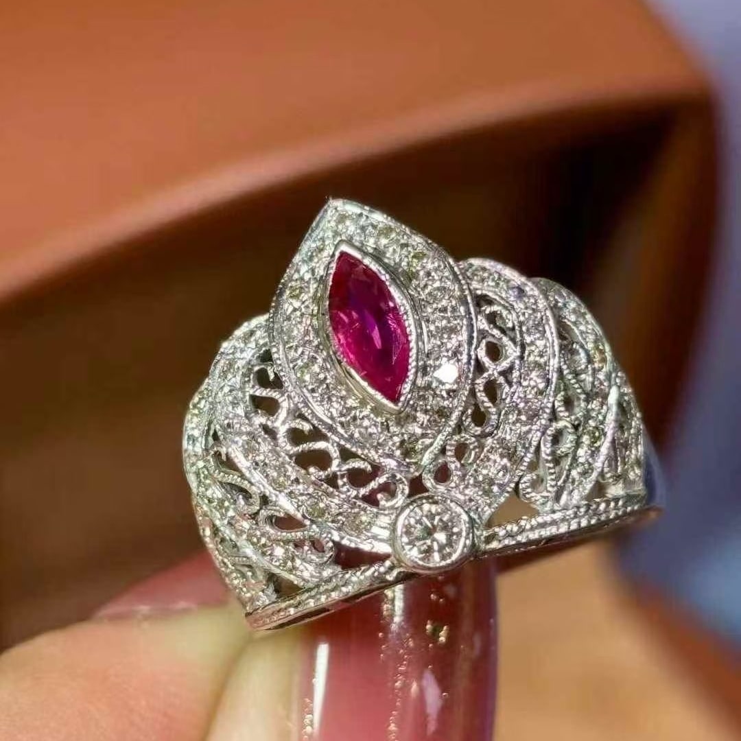 14k Gold 0.7 Ct Natural Ruby & Diamond Ring: Ref:231053131 // gold content:14k gold // ring size:7. 25us // // main gemstone:ruby // shape:marquise // carat weight:0. 7ct // color:red // treatment:natural // // adjacent gemstone 2 : diamond //