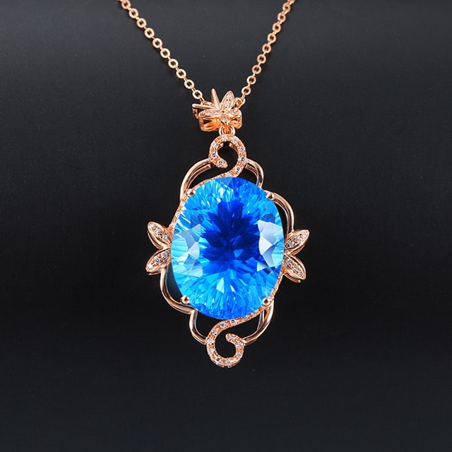 14k Gold 17.29 Ctw Natural Topaz & Diamond Pendant( Without Chain ): Ref:231053147 // gold content:14k gold // main gemstone:topaz // shape:oval // carat weight:17. 14ct // color:blue // treatment:natural // // adjacent gemstone 2 : diamond // number of stones:50 //