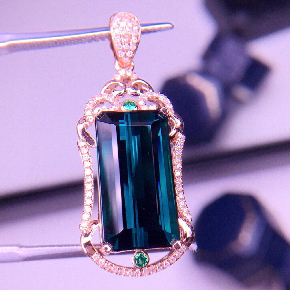 14k Gold 7.1 Ct Natural Tourmaline & Diamond Pendant( Without Chain ): Ref:231053153 // gold content:14k gold // main gemstone:tourmaline // shape:octagonal // carat weight:7. 1ct // color:blue // treatment:natural // // adjacent gemstone 2 : diamond // shape:round //