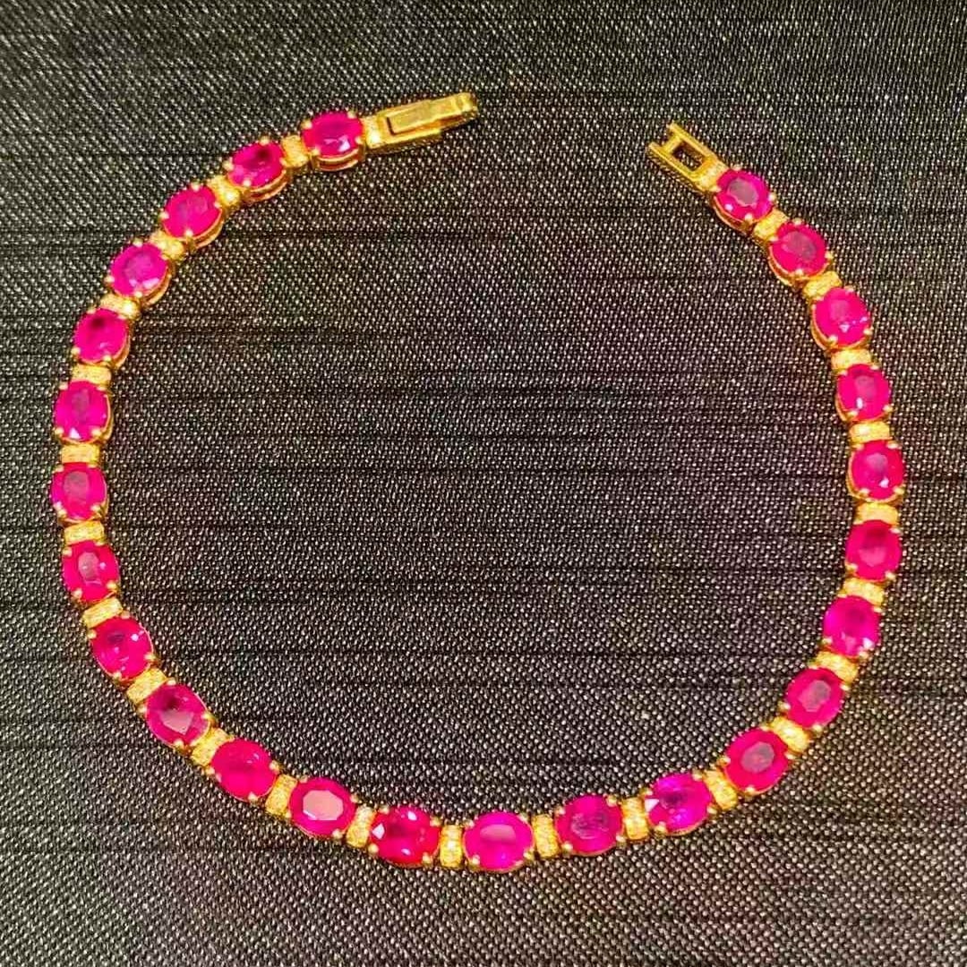 14k Gold 11.5 Ct Natural Ruby & Diamond Bracelet: Ref:231053213 // gold content:14k gold // main gemstone:ruby // shape:oval // carat weight:11. 5ct // color:red // treatment:natural // // adjacent gemstone 2 : diamond // shape:round // clarity
