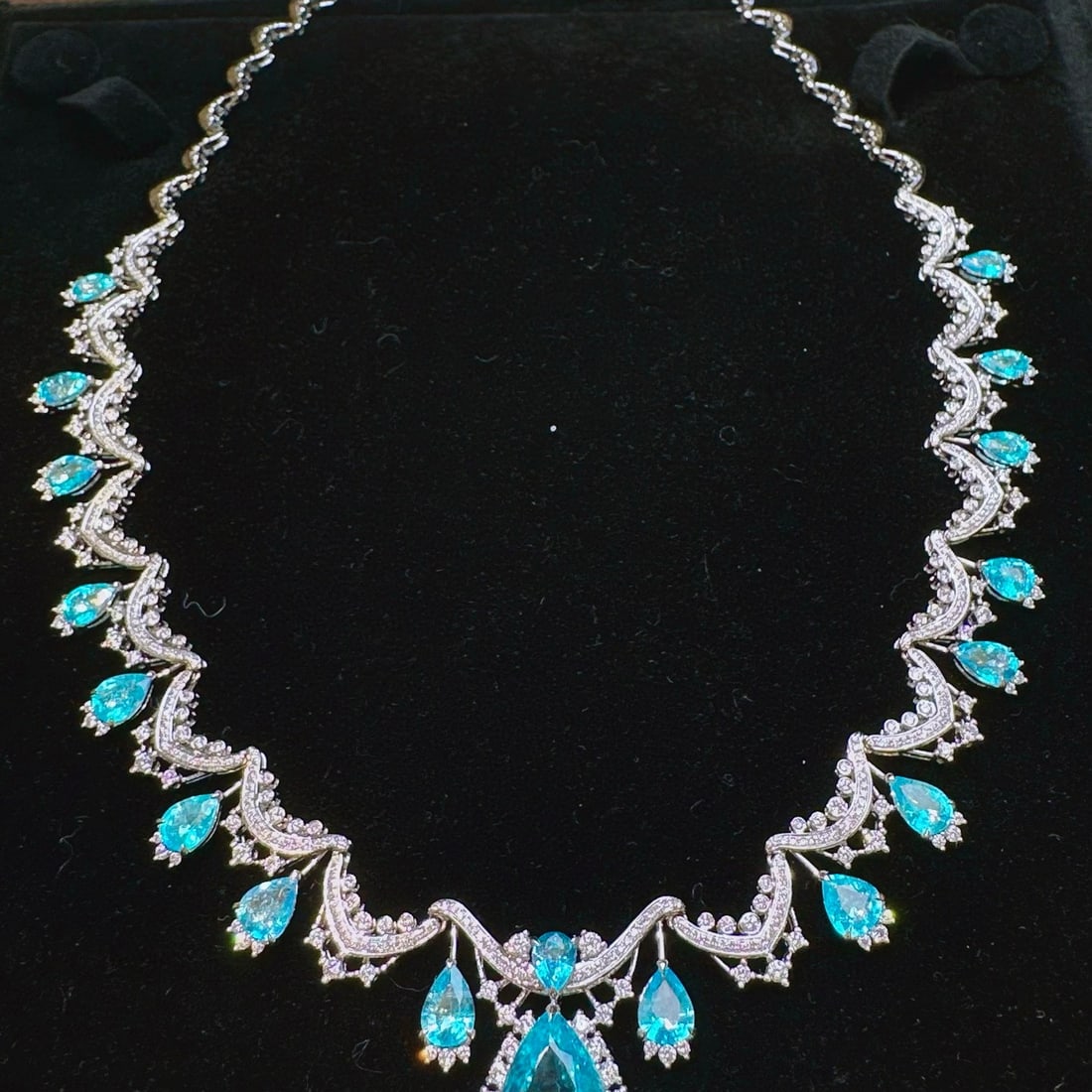 14k Gold 17.50 Ctw Natural Paraiba Tourmaline & Diamond Necklace: Ref:231054001 // gold content:14k gold // main gemstone:paraiba tourmaline // shape:pear // carat weight:13. 71ct // color:blue // treatment:natural // // adjacent gemstone 2 : diamond //