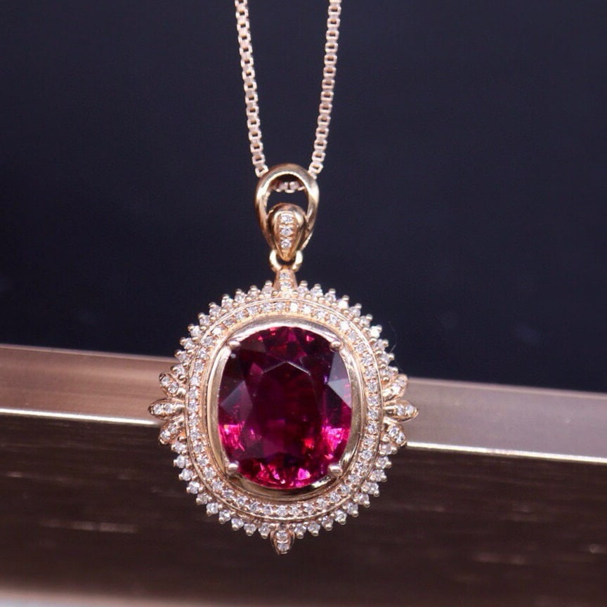 14k Gold 4.62 Ct Natural Tourmaline & Diamond Pendant( Without Chain ): Ref:231054029 // gold content:14k gold // main gemstone:tourmaline // shape:oval // carat weight:4. 62ct // color:red // treatment:natural // // adjacent gemstone 2 : diamond // number of stones:104