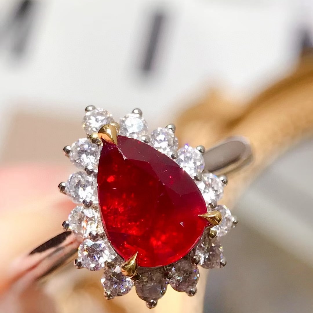 14k Gold 2.12 Ctw Natural Ruby & Diamond Ring: Ref:231054044 // gold content:14k gold // ring size:7. 25us // // main gemstone:ruby // shape:pear // carat weight:1. 6ct // color:pigeonblood red // treatment:natural // // adjacent gemstone 2 : diam