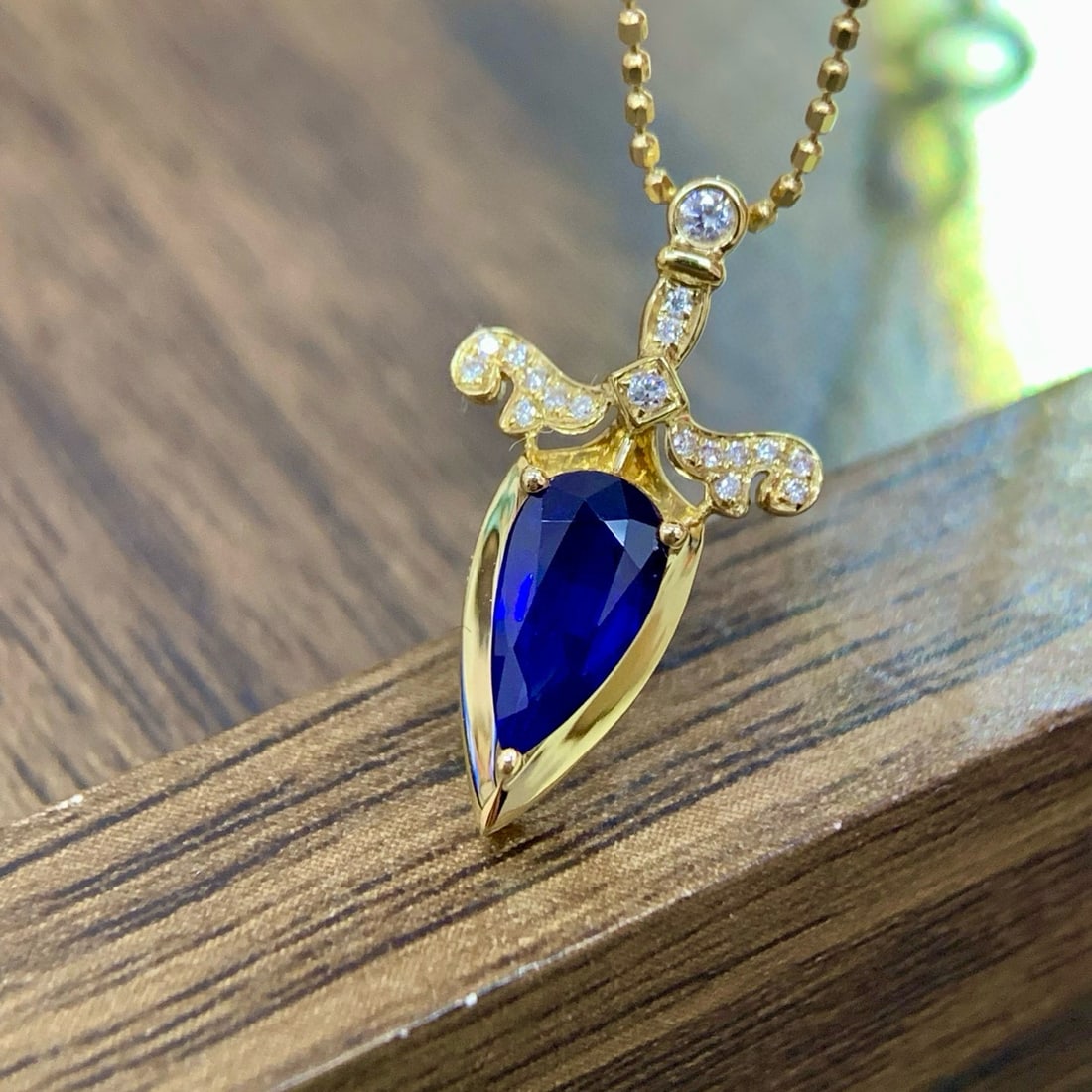 14k Gold 0.88 Ctw Vivid Blue Natural Sapphire & Diamond Pendant( Without Chain ): Ref:231054069 // gold content:14k gold // main gemstone:sapphire // shape:pear // carat weight:0. 83ct // color:vivid blue // treatment:natural // // adjacent gemstone 2 : diamond // shape:round //