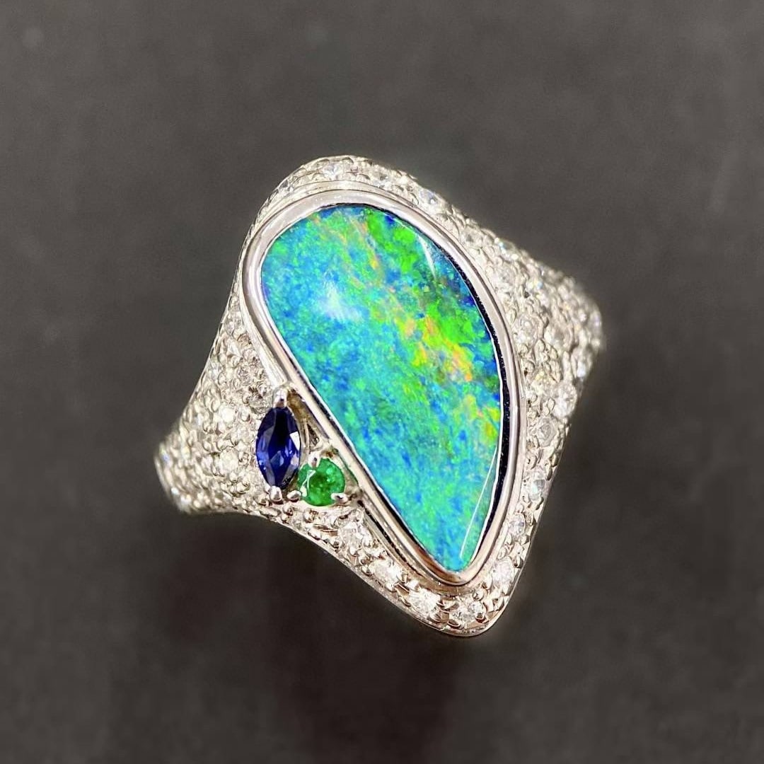 14k Gold 4.76 Ctw Natural Opal & Diamond Ring: Ref:231054104 // gold content:14k gold // ring size:7. 25us // // main gemstone:opal // shape:other // carat weight:4. 07ct // color:color // treatment:natural // // adjacent gemstone 2 : diamond //