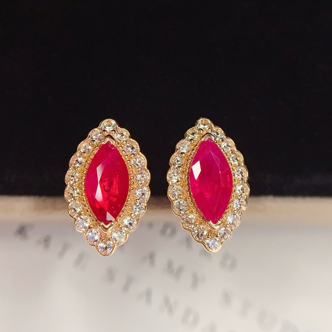 14k Gold 1.2 Ct Natural Ruby & Sapphire Earrings: Ref:231054214 // gold content:14k gold // main gemstone:ruby // shape:marquise // carat weight:1. 2ct // color:red // treatment:natural // // adjacent gemstone 2 : sapphire // number of stones:36 //