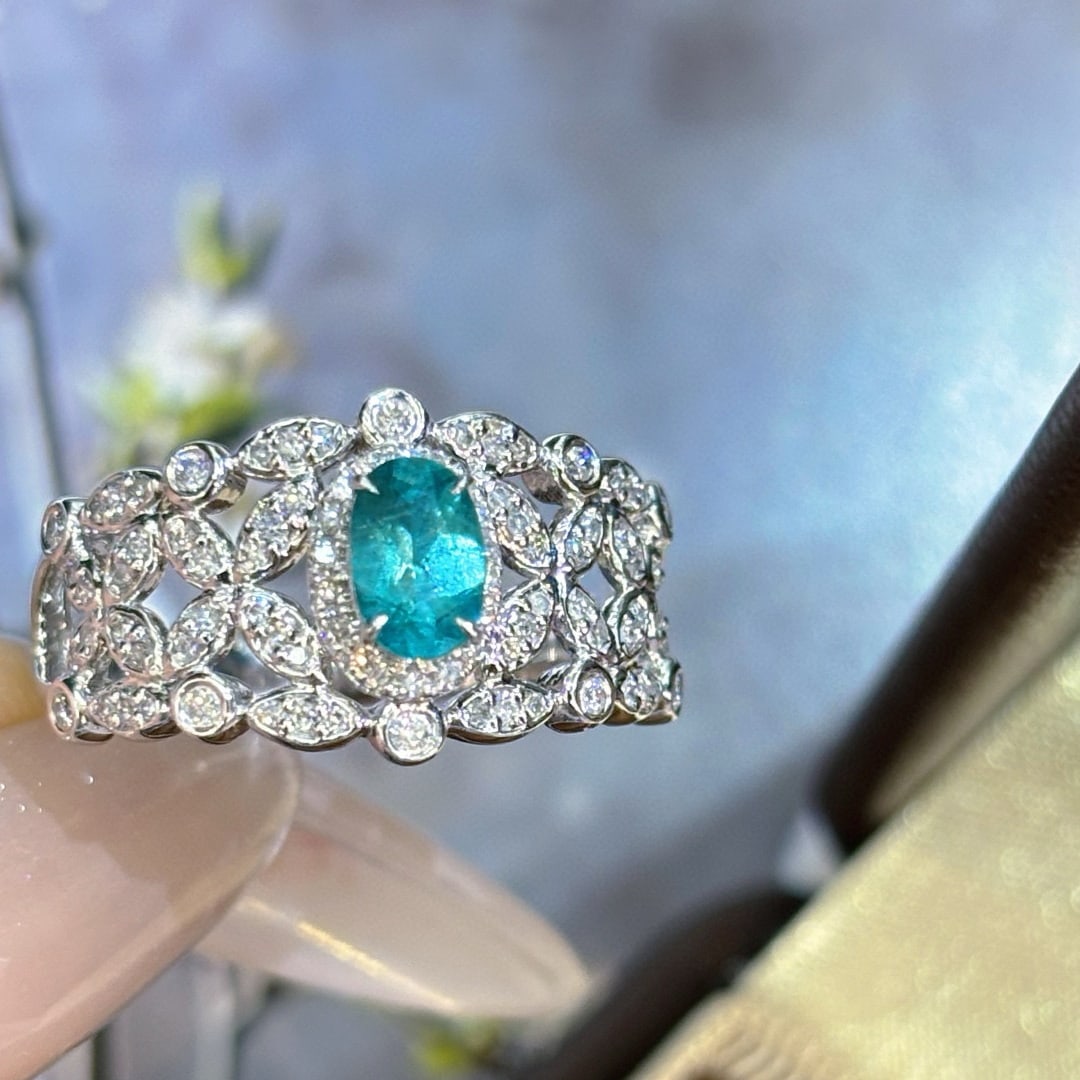 14k Gold 0.4 Ct Natural Paraiba Tourmaline & Diamond Ring: Ref:231054377 // gold content:14k gold // ring size:7. 25us // // main gemstone:paraiba tourmaline // shape:oval // carat weight:0. 4ct // color:blue // treatment:natural // // adjacent gemstone 2 :