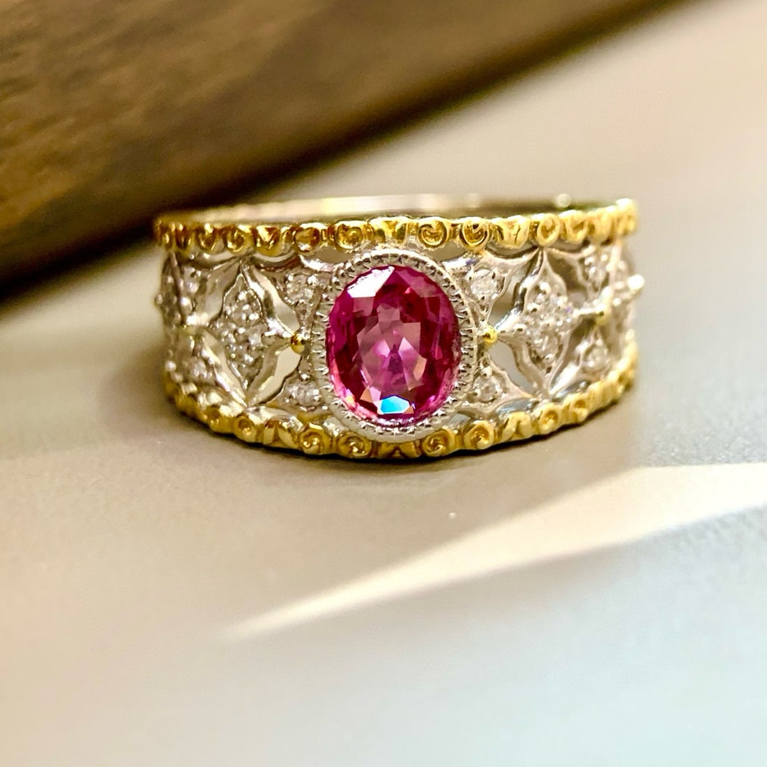 14k Gold 0.73 Ctw Natural Padparadscha Sapphire & Diamond Ring: Ref:231054383 // gold content:14k gold // ring size:7. 25us // // main gemstone:padparadscha sapphire // shape:oval // carat weight:0. 61ct // color:orangish pink // treatment:natural // // adjacent