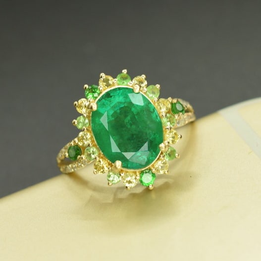 14k Gold 2.46 Ct Vivid Green Natural Emerald & Diamond & Sapphire & Tsavorite Ring: Ref:231055060 // gold content:14k gold // ring size:7. 25us // // main gemstone:emerald // shape:oval // carat weight:2. 46ct // color:vivid green // treatment:natural // // adjacent gemstone 2 :