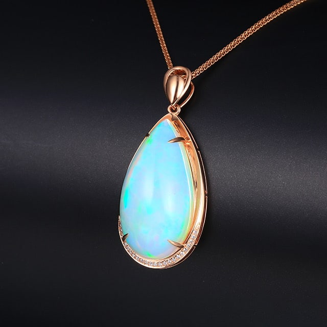 14k Gold 16.32 Ctw Natural Opal & Diamond Pendant( Without Chain ): Ref:231055068 // gold content:14k gold // main gemstone:opal // shape:pear // carat weight:16. 25ct // color:white // treatment:natural // // adjacent gemstone 2 : diamond // number of stones:24 // sh