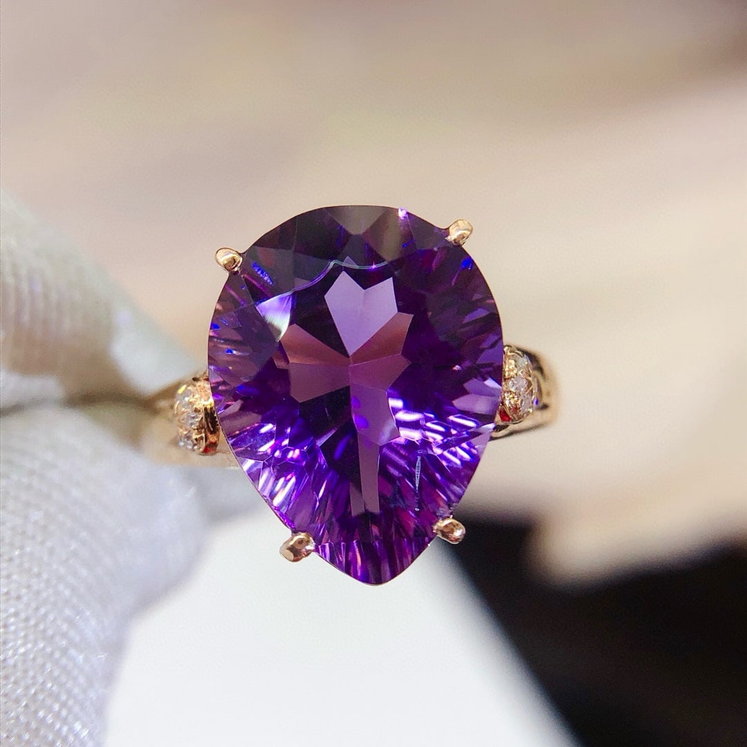 14k Gold 5.25 Ct Natural Amethyst & Diamond Ring: Ref:231055094 // gold content:14k gold // ring size:7. 25us // // main gemstone:amethyst // shape:pear // carat weight:5. 25ct // color:purple // treatment:natural // // adjacent gemstone 2 : diamond