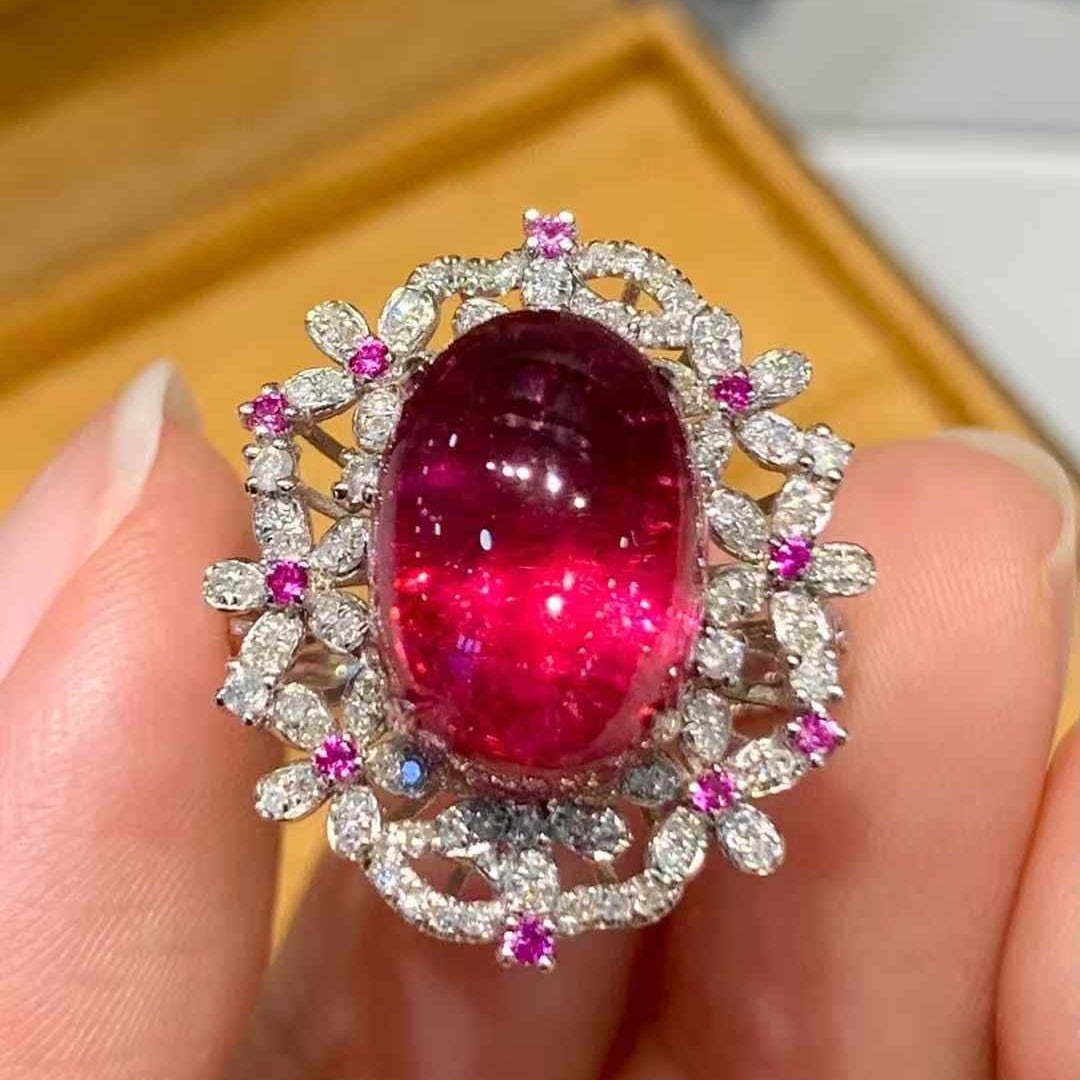 14k Gold 7.3 Ct Natural Tourmaline & Diamond Ring: Ref:231055125 // gold content:14k gold // ring size:7. 25us // // main gemstone:tourmaline // shape:oval // carat weight:7. 3ct // color:red // treatment:natural // // adjacent gemstone 2 : diamond //