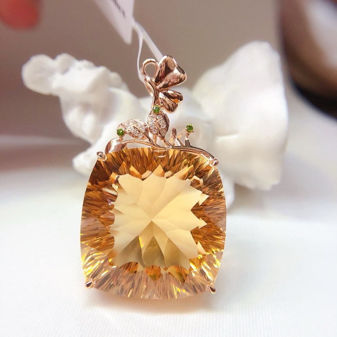 14k Gold 50 Ct Natural Citrine & Diamond Pendant( Without Chain ): Ref:231055132 // gold content:14k gold // main gemstone:citrine // shape:cushion // carat weight:50ct // color:yellow // treatment:natural // // adjacent gemstone 2 : diamond // shape:round // clarity