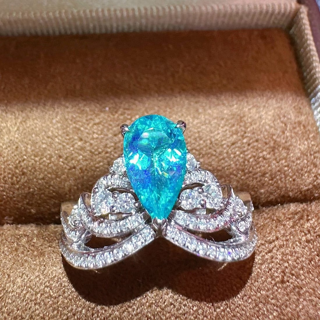 14k Gold 1.30 Ctw Natural Paraiba Tourmaline & Diamond Ring: Ref:231055161 // gold content:14k gold // ring size:7. 25us // // main gemstone:paraiba tourmaline // shape:pear // carat weight:0. 86ct // color:blue // treatment:natural // // adjacent gemstone 2 :