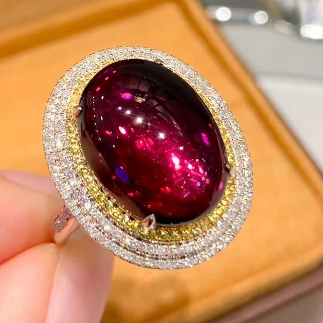 14k Gold 7.2 Ct Natural Tourmaline & Diamond Ring: Ref:231055253 // gold content:14k gold // ring size:7. 25us // // main gemstone:tourmaline // shape:oval // carat weight:7. 2ct // color:red // treatment:natural // // adjacent gemstone 2 : diamond //