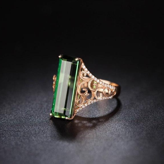 14k Gold 7.35 Ct Natural Tourmaline & Diamond Ring: Ref:231056009 // gold content:14k gold // ring size:7. 25us // // main gemstone:tourmaline // shape:octagonal // carat weight:7. 35ct // color:green // treatment:natural // // adjacent gemstone 2 : di
