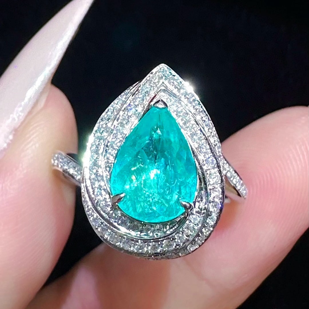 14k Gold 1.44 Ctw Natural Paraiba Tourmaline & Diamond Ring: Ref:231056192 // gold content:14k gold // ring size:7. 25us // // main gemstone:paraiba tourmaline // shape:pear // carat weight:1. 1ct // color:blue // treatment:natural // // adjacent gemstone 2 : d