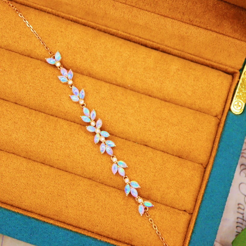 14k Gold 2.30 Ctw Natural Opal & Diamond Bracelet: Ref:231056206 // gold content:14k gold // main gemstone:opal // shape:marquise // carat weight:2. 21ct // color:color // treatment:natural // // adjacent gemstone 2 : diamond // number of stones:9 //