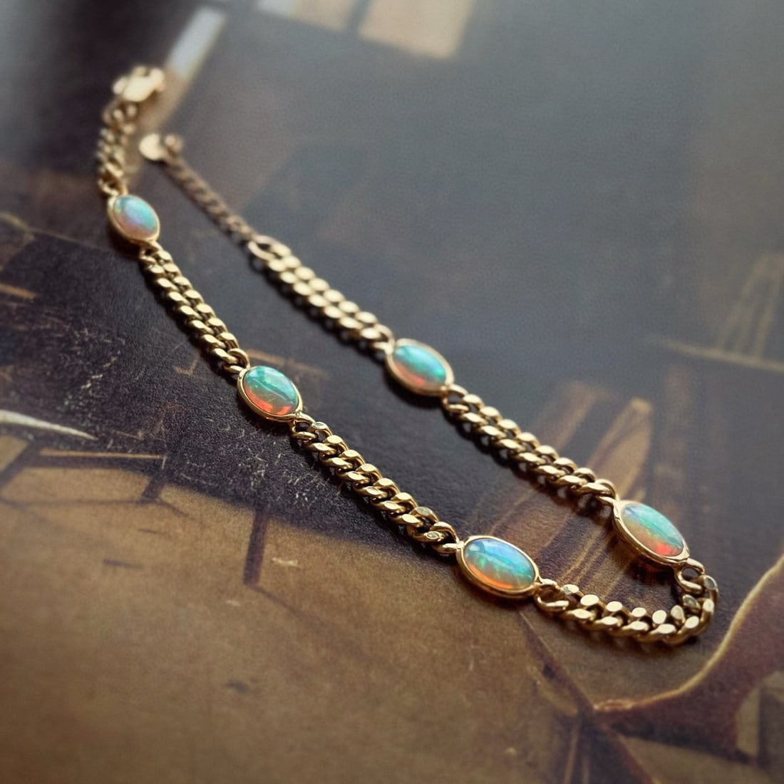 14k Gold 1.3 Ct Natural Opal Bracelet: Ref:231056387 // gold content:14k gold // main gemstone:opal // shape:oval // carat weight:1. 3ct // color:color // treatment:natural // High Estimate: 6300 Condition: New Low Estimate: 4200