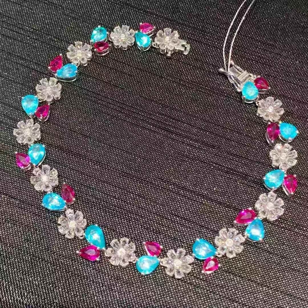 14k Gold 9.3 Ct Natural Paraiba Tourmaline & Ruby & Sapphire Bracelet: Ref:231057088 // gold content:14k gold // main gemstone:paraiba tourmaline & ruby // shape:pear // carat weight:9. 3ct // color:neon blue & red // treatment:natural // // adjacent gemstone 2 :