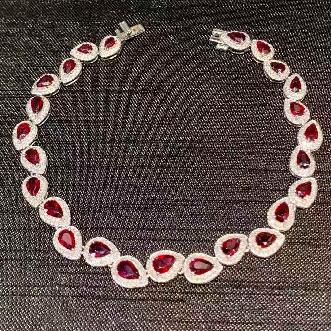 14k Gold 5.2 Ct Natural Ruby & Diamond Bracelet: Ref:231057108 // gold content:14k gold // main gemstone:ruby // shape:pear // carat weight:5. 2ct // color:red // treatment:natural // // adjacent gemstone 2 : diamond // shape:round // clarity grade: