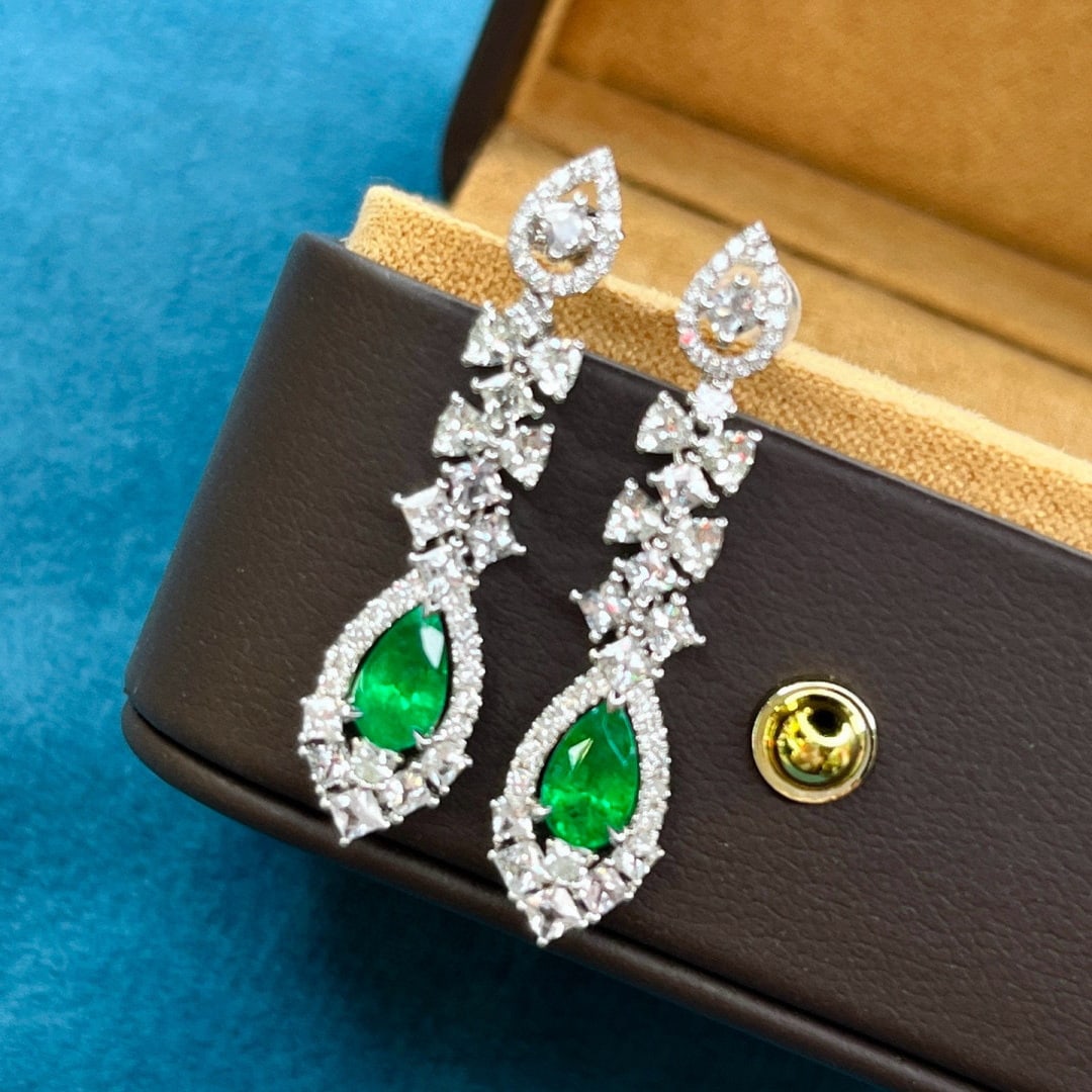14k Gold 2.98 Ctw Vivid Green Natural Emerald & Sapphire Earrings: Ref:231058062 // gold content:14k gold // main gemstone:emerald // shape:pear // carat weight:1. 16ct // color:vivid green // treatment:natural // // adjacent gemstone 2 : sapphire // shape:multiply /