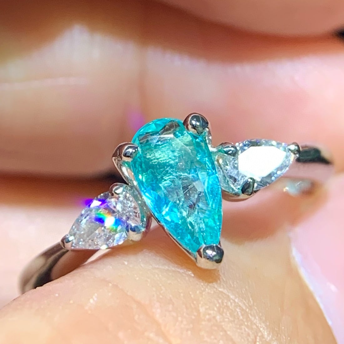 14k Gold 0.77 Ctw Natural Paraiba Tourmaline & Diamond Ring: Ref:231058400 // gold content:14k gold // ring size:7. 25us // // main gemstone:paraiba tourmaline // shape:pear // carat weight:0. 52ct // color:blue // treatment:natural // // adjacent gemstone 2 : 