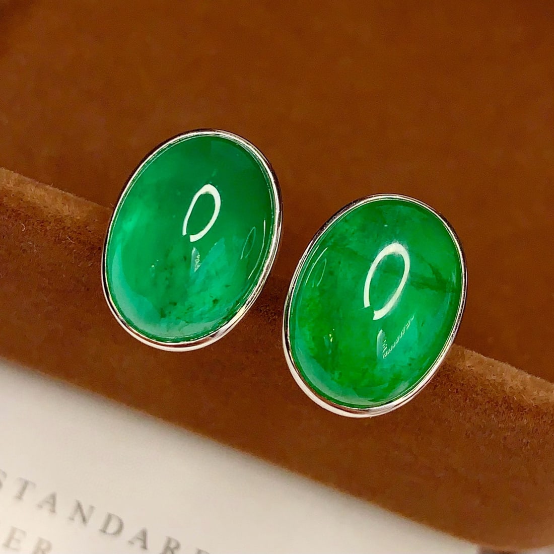 14k Gold 16.2 Ct Natural Emerald Earrings: Ref:231058438 // gold content:14k gold // main gemstone:emerald // shape:oval // carat weight:16. 2ct // color:green // treatment:natural // Condition: New Low Estimate: 39000.00 High Estimate: