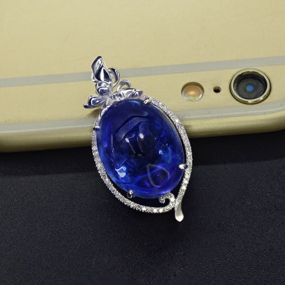 14k Gold 16.53 Ctw Natural Tanzanite & Diamond Pendant( Without Chain ): Ref:231059053 // gold content:14k gold // main gemstone:tanzanite // shape:oval // carat weight:16. 39ct // color:blue // treatment:natural // // adjacent gemstone 2 : diamond // number of stones:47