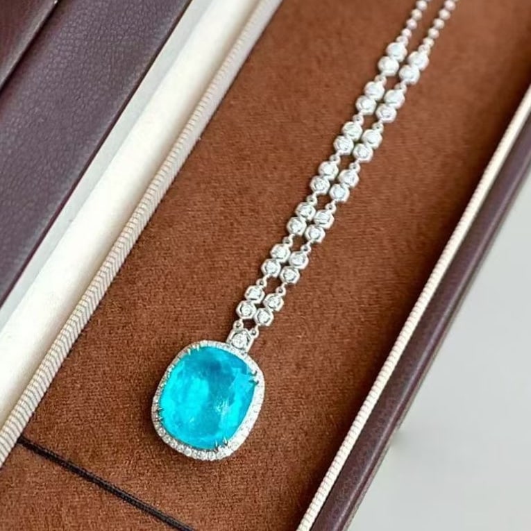 14k Gold 9.79 Ctw Natural Paraiba Tourmaline & Diamond Necklace: Ref:231059140 // gold content:14k gold // main gemstone:paraiba tourmaline // shape:cushion // carat weight:9. 09ct // color:blue // treatment:natural // // adjacent gemstone 2 : diamond //