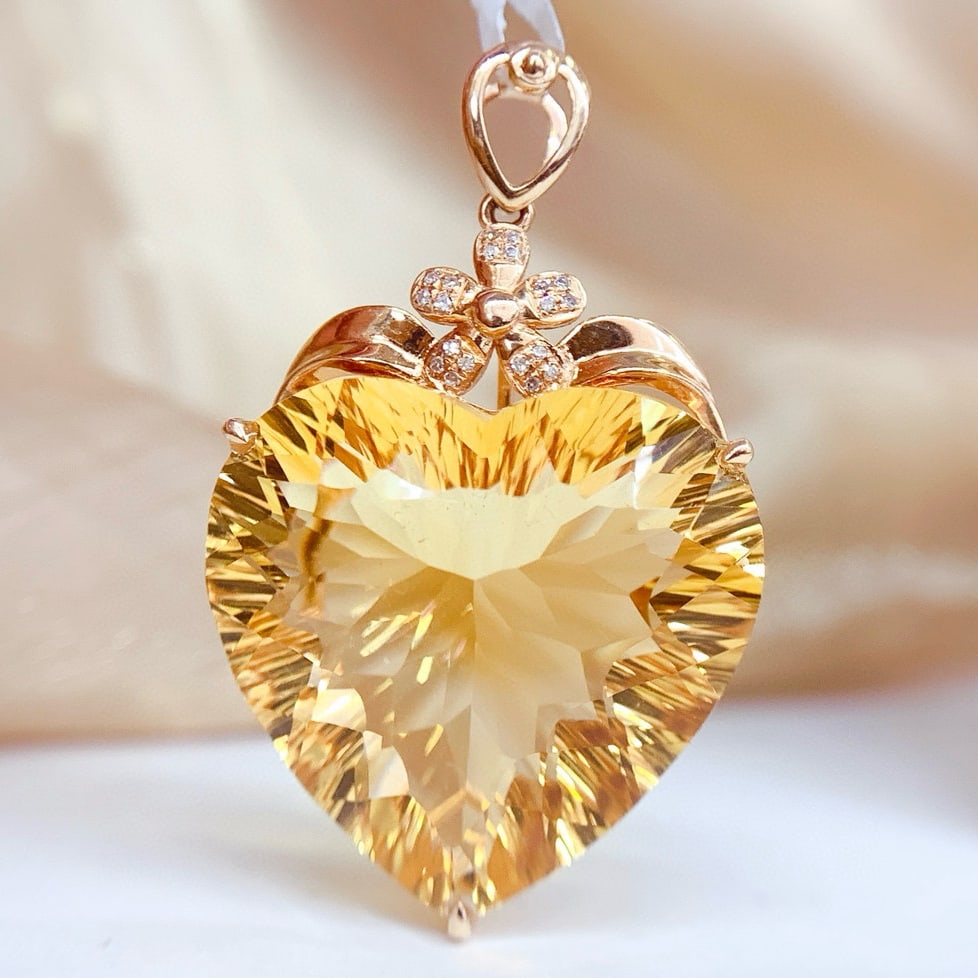 14k Gold 32 Ct Natural Citrine & Diamond Pendant( Without Chain ): Ref:231059147 // gold content:14k gold // main gemstone:citrine // shape:heart // carat weight:32ct // color:yellow // treatment:natural // // adjacent gemstone 2 : diamond // number of stones:20 //