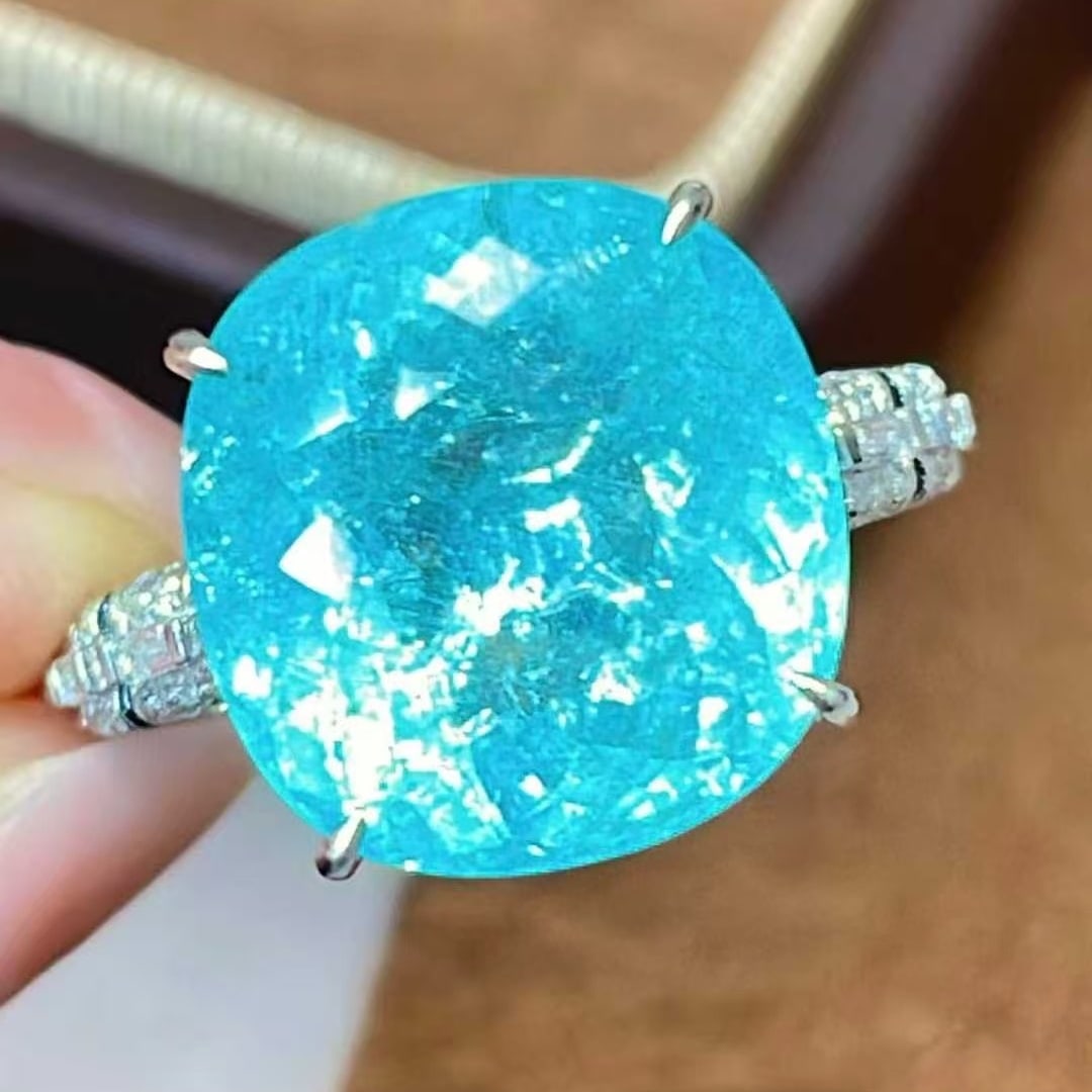 14k Gold 9.6 Ct Natural Paraiba Tourmaline & Diamond Ring: Ref:231059219 // gold content:14k gold // ring size:7. 25us // // main gemstone:paraiba tourmaline // shape:cushion // carat weight:9. 6ct // color:blue // treatment:natural // // adjacent gemstone 2 