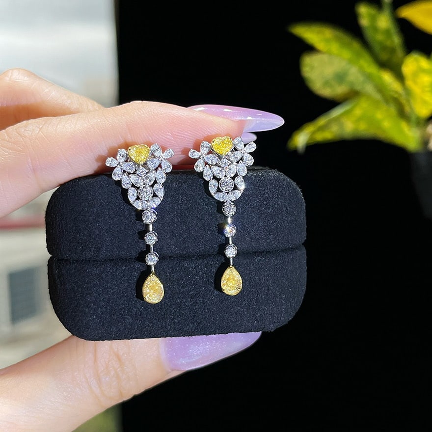 14k Gold 2.1 Ct Natural Color Diamond Earrings: Ref:231059253 // gold content:14k gold // main gemstone:diamond // shape:multiple // carat weight:2. 1ct // clarity grade:vs-si // color:color // treatment:natural // Low Estimate: 9000 Condition: