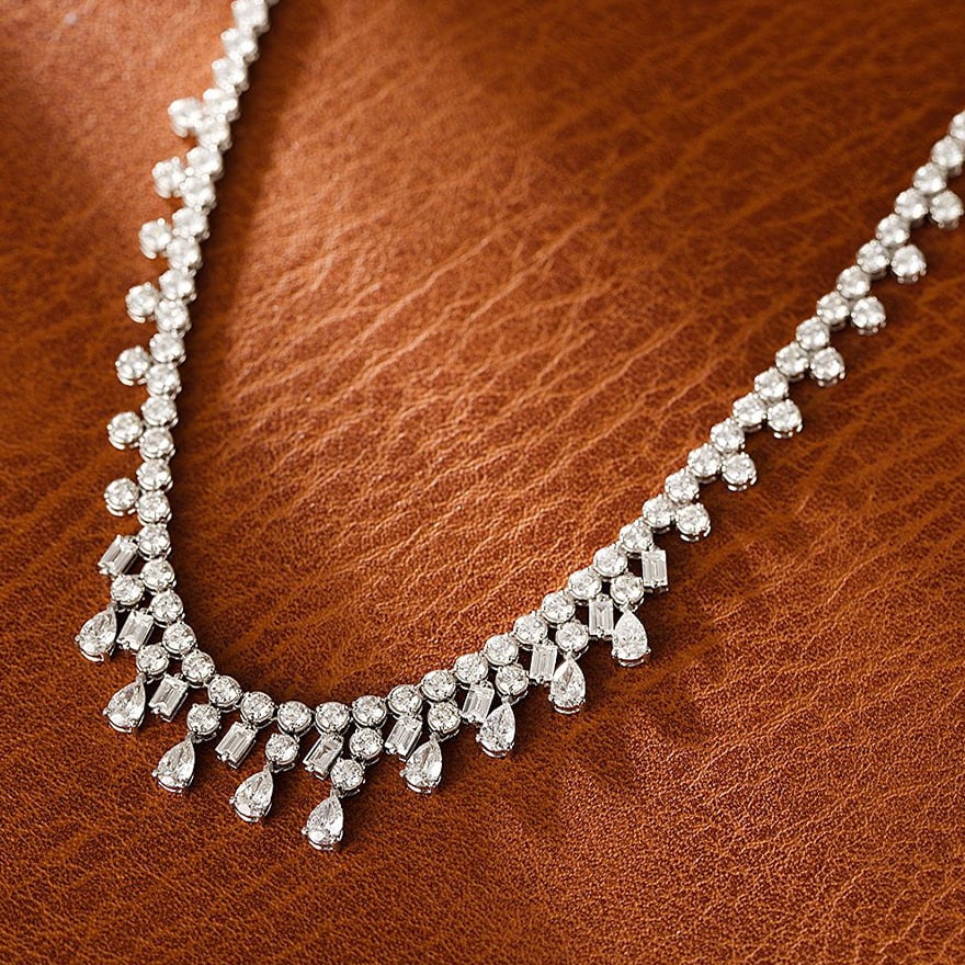 14k Gold 9.4 Ct Natural H Diamond Necklace: Ref:231060233 // gold content:14k gold // main gemstone:diamond // shape:multiply // carat weight:9. 4ct // clarity grade:vs-si // color:h // treatment:natural // Condition: New High Estimate: 64000