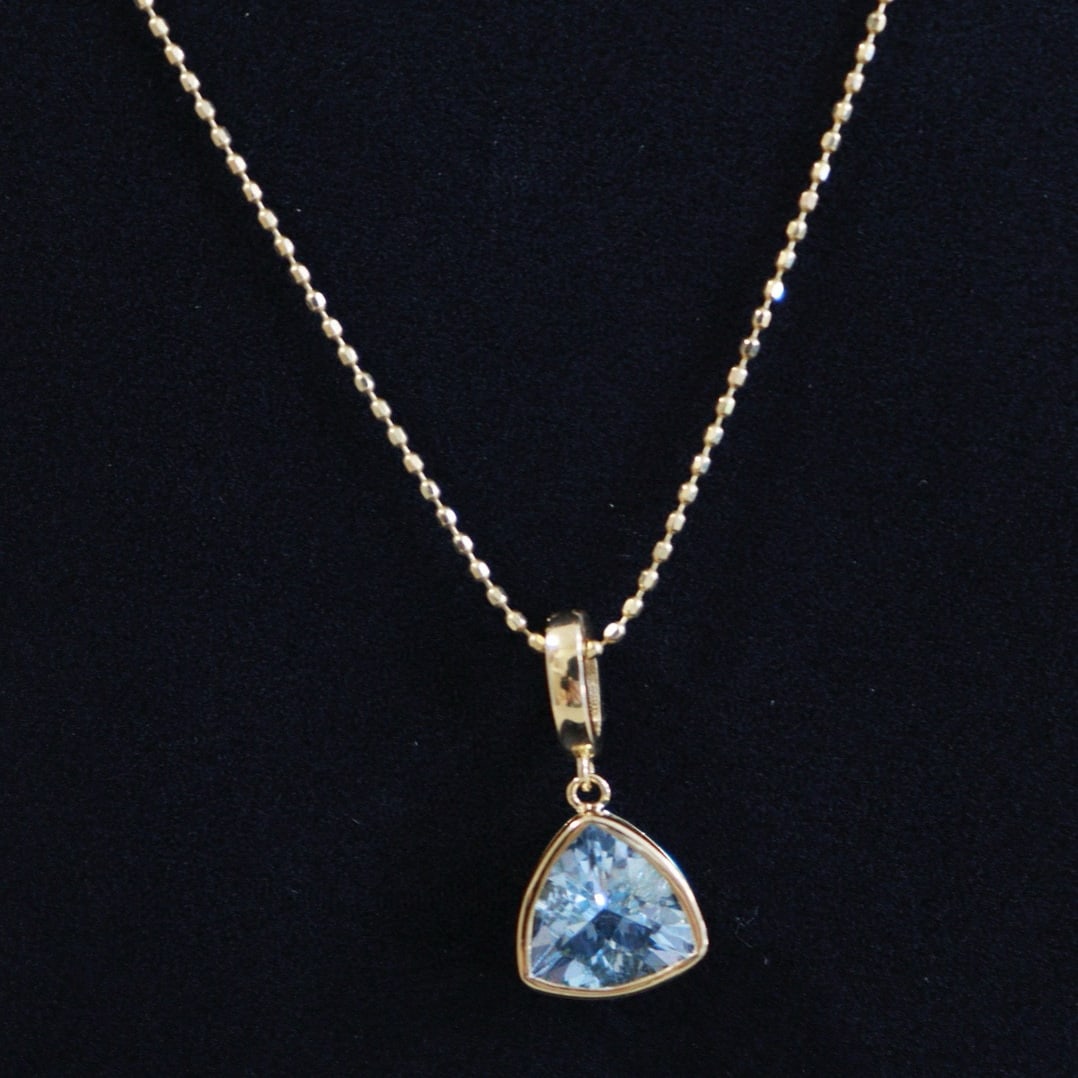 14k Gold 0.9 Ct Natural Aquamarine Pendant( Without Chain ): Ref:231060389 // gold content:14k gold // main gemstone:aquamarine // shape:triangle // carat weight:0. 9ct // color:santa maria color // treatment:natural // Condition: New Low Estimate: 1100 High