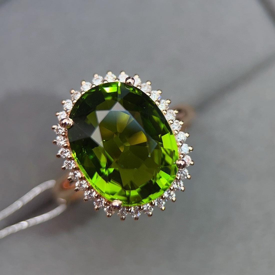 14k Gold 8.22 Ctw Natural Tourmaline & Diamond Ring: Ref:231060414 // gold content:14k gold // ring size:7. 25us // // main gemstone:tourmaline // shape:oval // carat weight:7. 9ct // color:green // treatment:natural // // adjacent gemstone 2 : diamond 