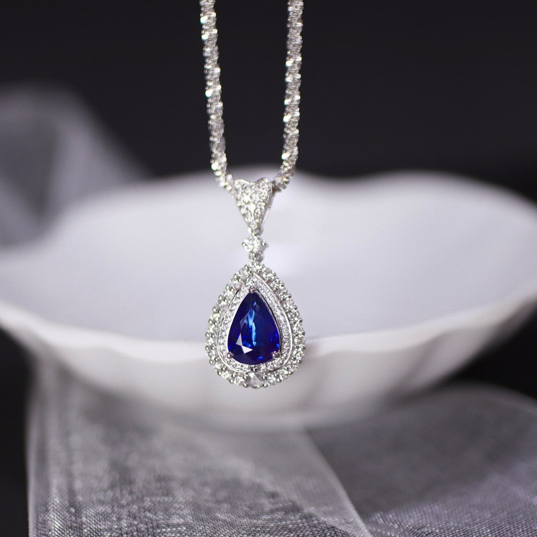 14k Gold 2.35 Ctw Natural Sapphire & Diamond Pendant( Without Chain ): Ref:231060422 // gold content:14k gold // main gemstone:sapphire // shape:pear // carat weight:1. 75ct // color:royal blue // treatment:natural // // adjacent gemstone 2 : diamond // shape:round //