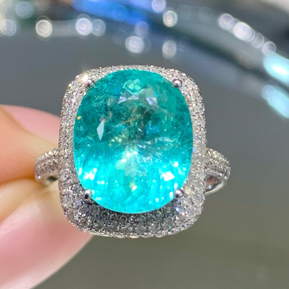 14k Gold 6 Ct Natural Paraiba Tourmaline & Diamond Ring: Ref:231061016 // gold content:14k gold // ring size:7. 25us // // main gemstone:paraiba tourmaline // shape:oval // carat weight:6ct // color:neon blue // treatment:natural // // adjacent gemstone 2