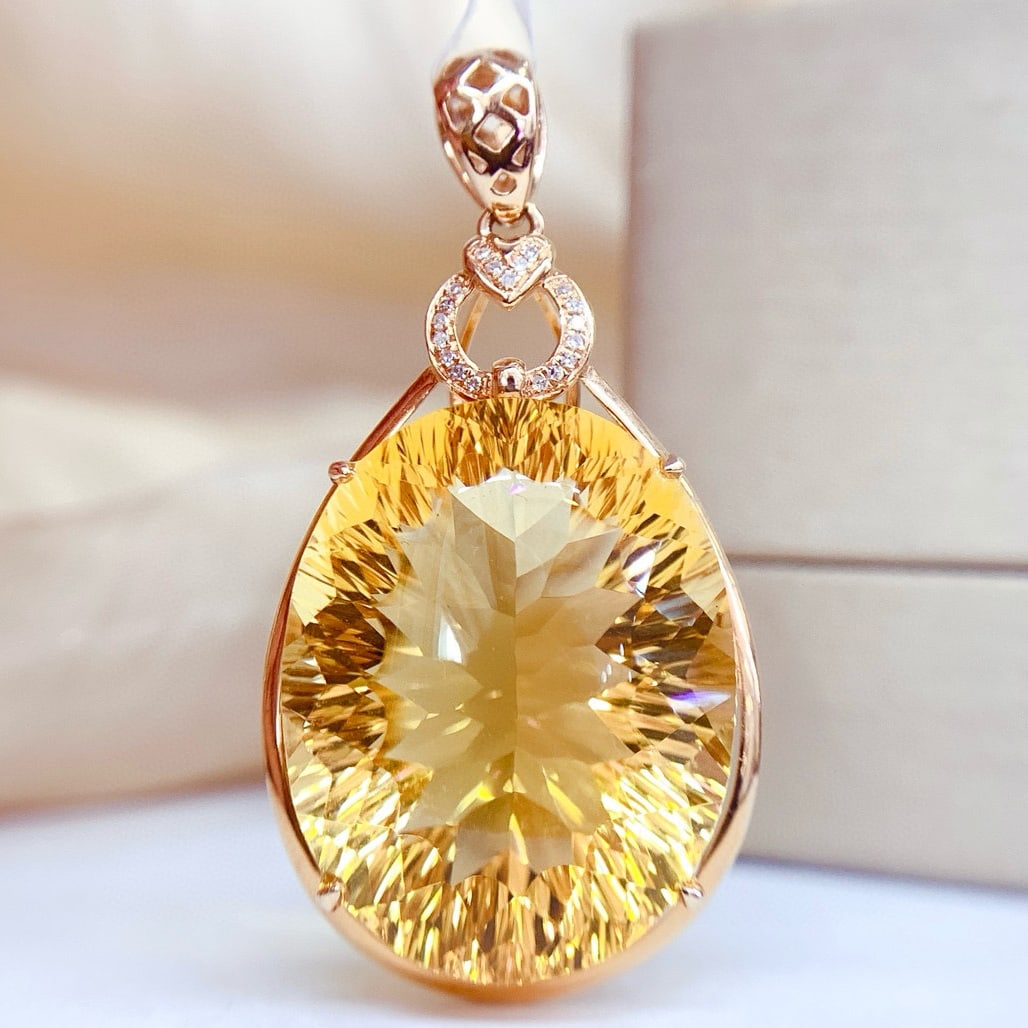 14k Gold 34.75 Ct Natural Citrine & Diamond Pendant( Without Chain ): Ref:231061021 // gold content:14k gold // main gemstone:citrine // shape:oval // carat weight:34. 75ct // color:yellow // treatment:natural // // adjacent gemstone 2 : diamond // number of stones:19