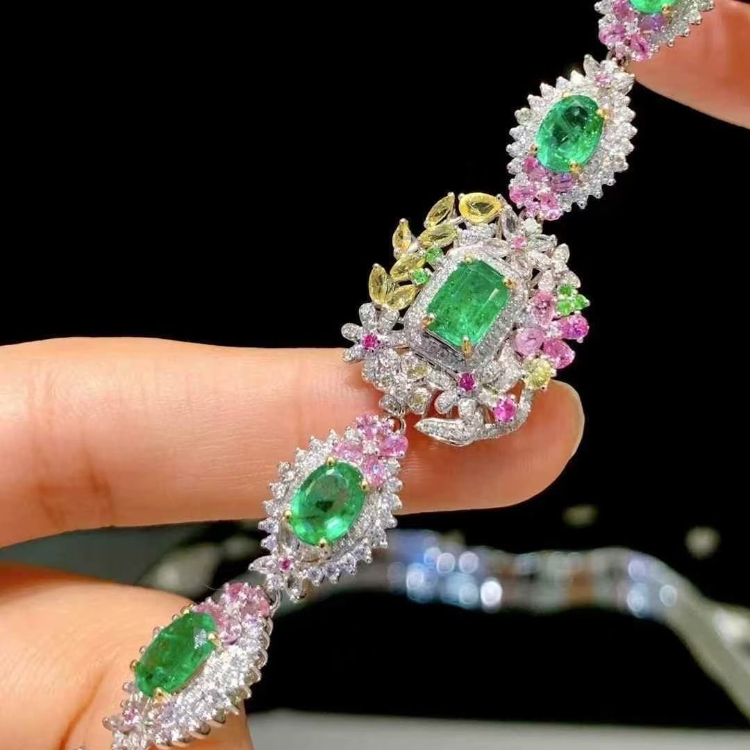 14k Gold 5.5 Ct Natural Emerald & Coloured Gemstone & Diamond Bracelet: Ref:231061069 // gold content:14k gold // main gemstone:emerald // shape:octagonal & oval // carat weight:5. 5ct // color:green // treatment:natural // // adjacent gemstone 2 : coloured gemstone // sh