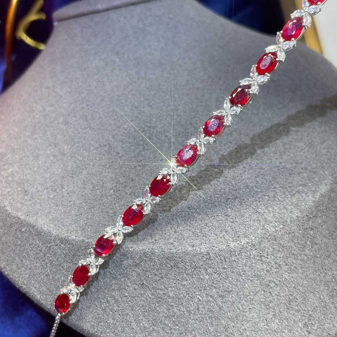 14k Gold 8.84 Ctw Natural Ruby & Sapphire Bracelet: Ref:231061108 // gold content:14k gold // main gemstone:ruby // shape:oval // carat weight:7. 3ct // color:red // treatment:natural // // adjacent gemstone 2 : sapphire // shape:marquise // carat weig