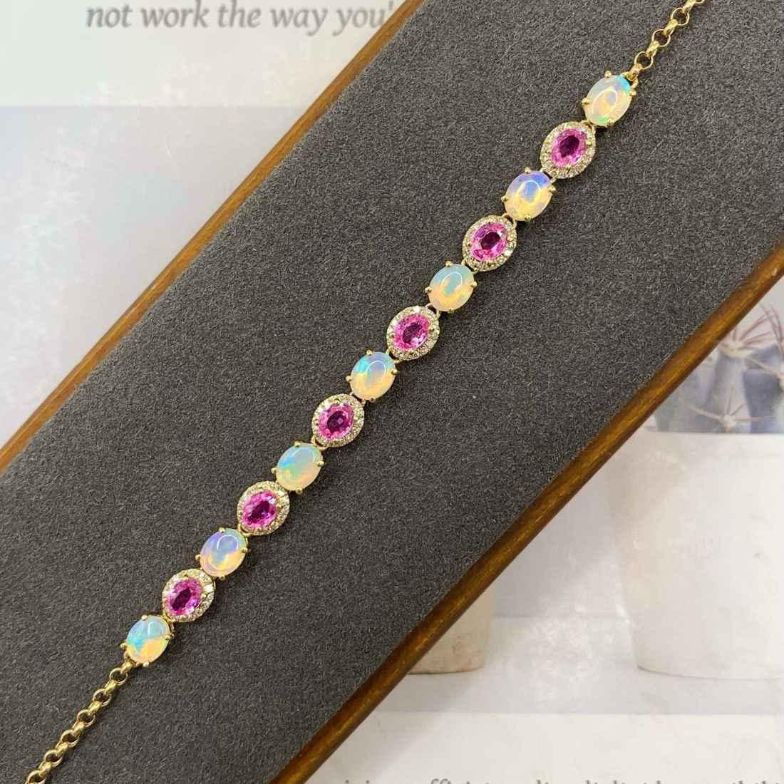 14k Gold 3.11 Ctw Natural Opal & Sapphire Bracelet: Ref:231061117 // gold content:14k gold // main gemstone:opal // shape:oval // carat weight:1. 56ct // color:white // treatment:natural // // adjacent gemstone 2 : sapphire // number of stones:6 //