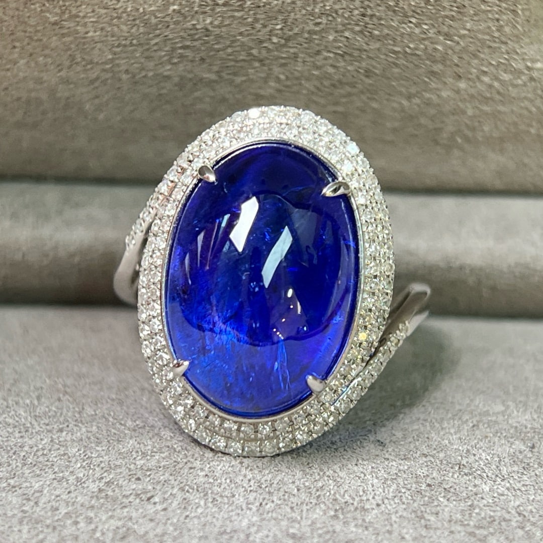 14k Gold 11.78 Ctw Natural Tanzanite & Diamond Ring: Ref:231061222 // gold content:14k gold // ring size:7. 25us // // main gemstone:tanzanite // shape:oval // carat weight:11. 4ct // color:blue // treatment:natural // // adjacent gemstone 2 : diamond